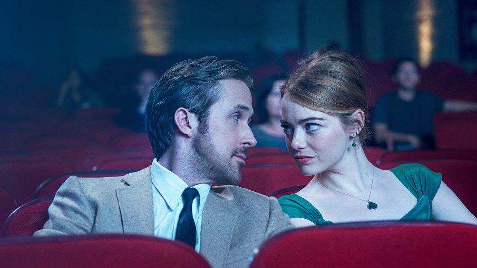 Ryan Gosling and Emma Stone in <i></noscript>La La Land</i>“><figcaption> <span class=